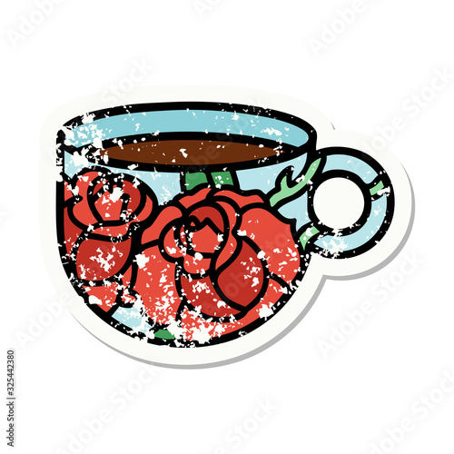 traditional distressed sticker tattoo of a cup and flowers
