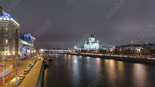 Majestic orthodox Cathedral of Christ Saviour illuminated at dusk on bank of Moscow river. Timelapse , Russia © neiezhmakov