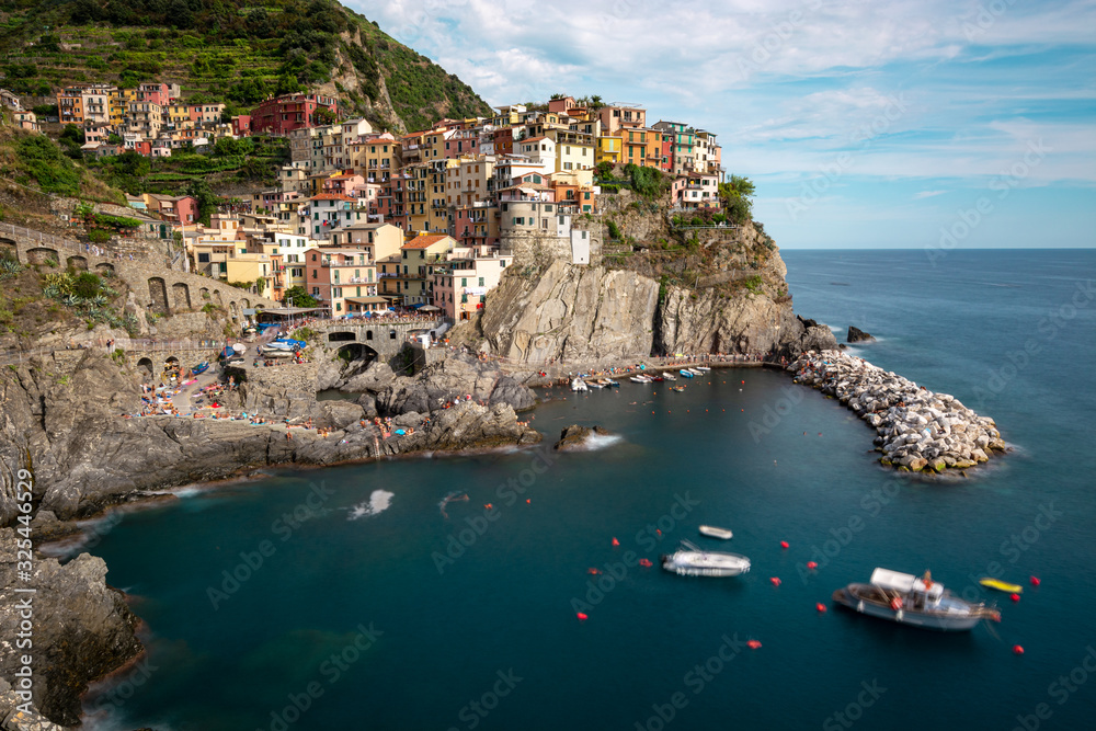 Manarola as one of the Cinque Terre villages on a sunny day