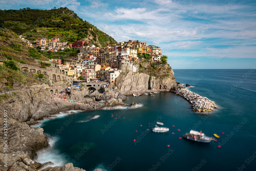 Manarola as one of the Cinque Terre villages on a sunny day