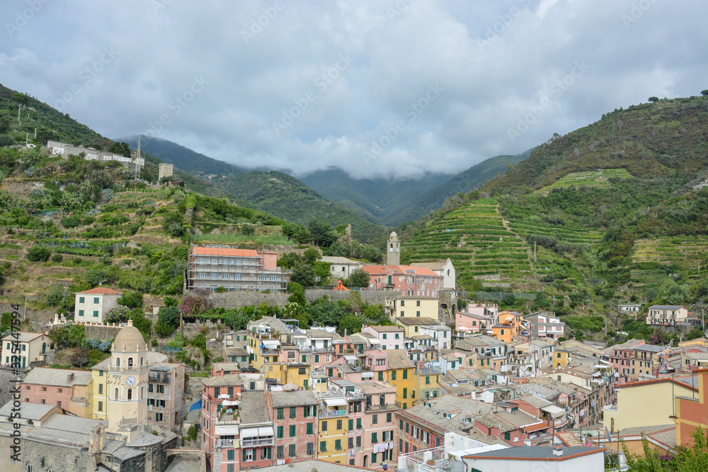 Vernazza and the mountains behind on a cloudy day