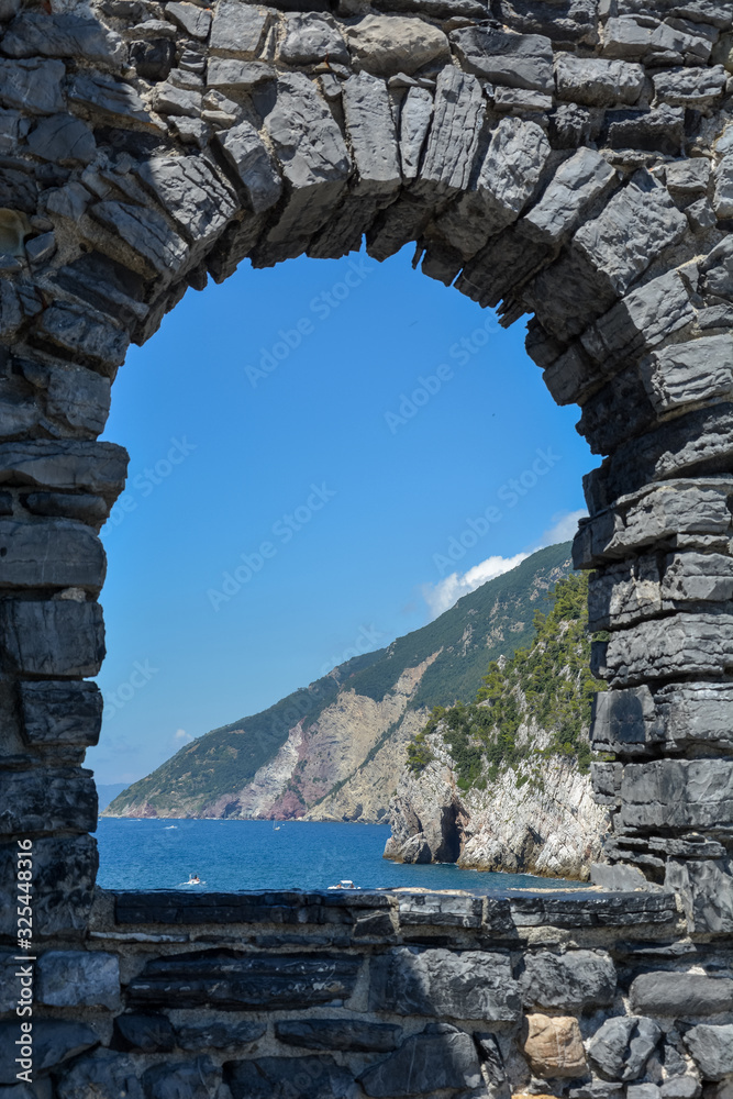 A rock window frame to Cliffs and the sea near Porto Venere