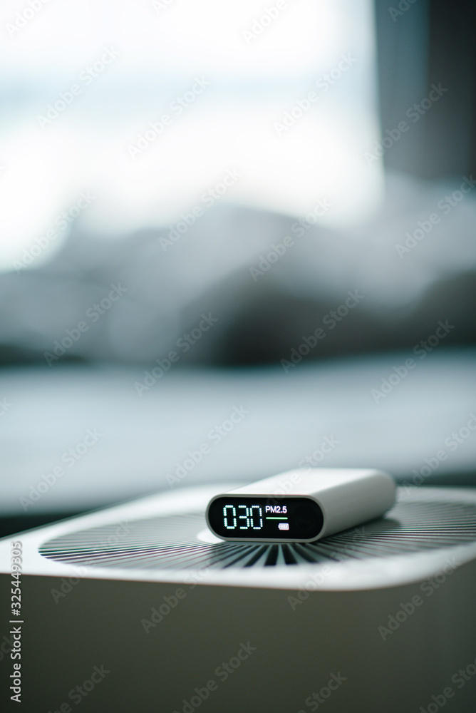 Obraz premium PM2.5 - measuring indoor air quality and air purifier effectiveness. Dust free area for health.