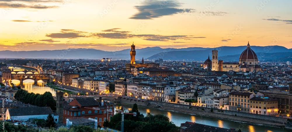 Panorama of Florence with Palazzo Vecchio and the cathedral Santa Maria del Fiore and Ponte Vecchio during sunset