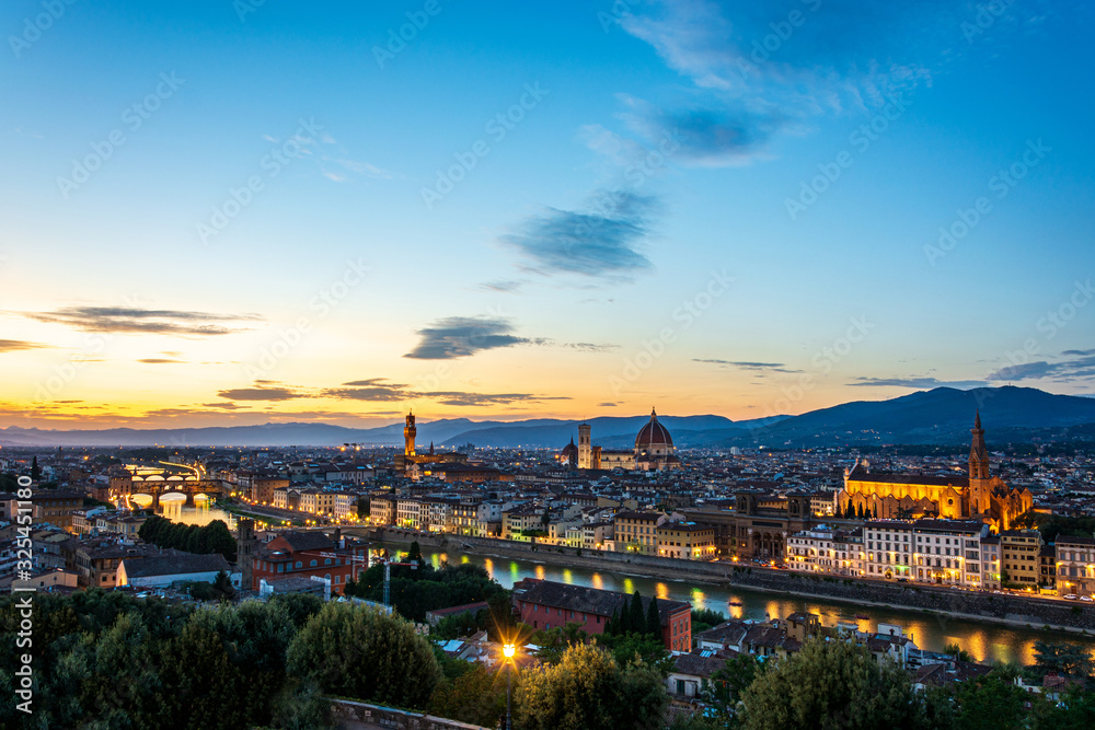 Panorama of Florence with Palazzo Vecchio and the cathedral Santa Maria del Fiore and Ponte Vecchio during sunset