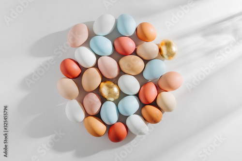 Natural Colored Eggs with morning sunlights. Stylish Compositions in pastel colors. Easter concept.