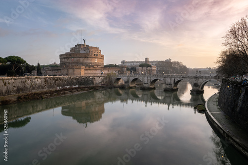Sunrise over the Mausoleum of Hadrian also known as Sant Angelo Castle roman symbol and landmark.