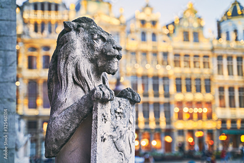 Lion Statue at the Grand Place in Brussels, Belgium at dusk photo