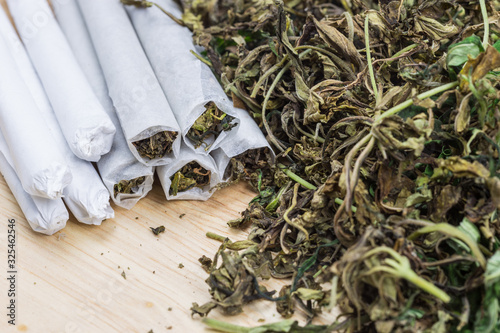 Marijuana on wood table.