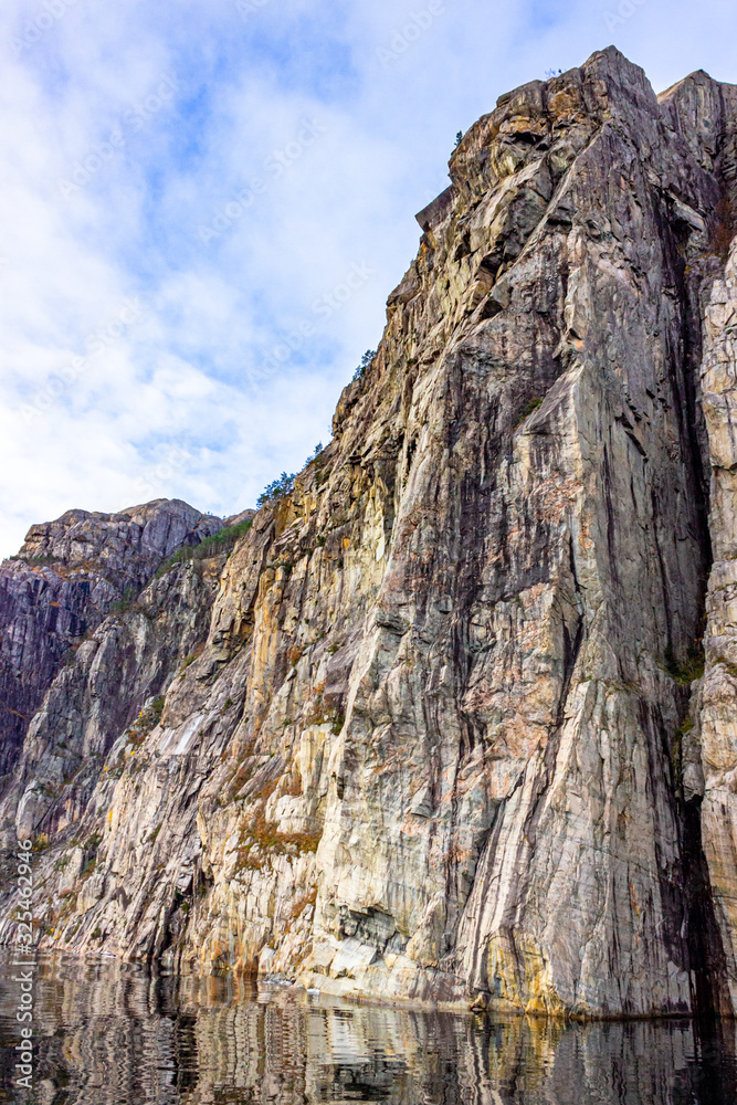 Gap in a mountain wall in the Lysefjord not far from the tourist attraction Preikestolen, Rogaland, Norway Gap in a mountain wall in the Lysefjord not far from the tourist attraction Preikestolen, Rogaland, Norway
