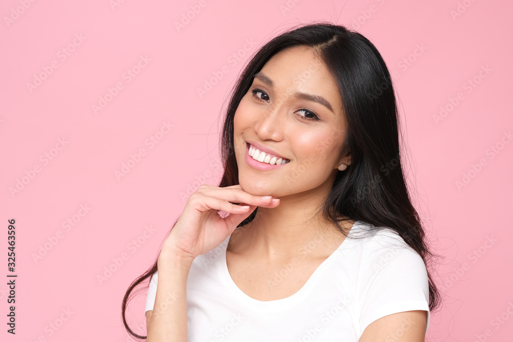 Beautiful portrait of asian model with healthy skin and amazing smile. Studio shoot on pink background. Beautiful portrait of asian model with healthy skin and amazing smile. Studio shoot on pink background.