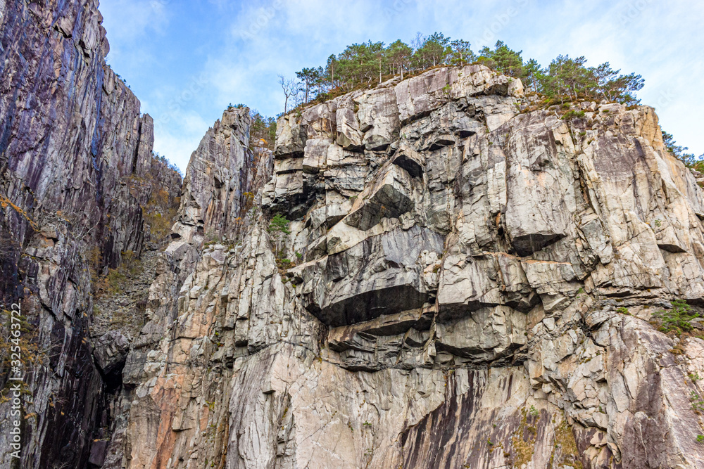 Edgy stone formations of a mountain wall in the Lysefjord, Rogaland, Norway Edgy stone formations of a mountain wall in the Lysefjord, Rogaland, Norway