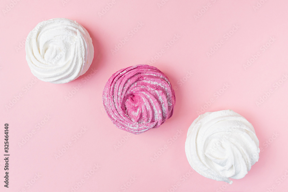 Fresh vanilla and berry marshmallows on a pastel pink background. The concept of home-cooked food, sweets. Minimalism, top view, flat lay, copyspace. Fresh vanilla and berry marshmallows on a pastel pink background. The concept of home-cooked food, sweets. Minimalism, top view, flat lay, copyspace.