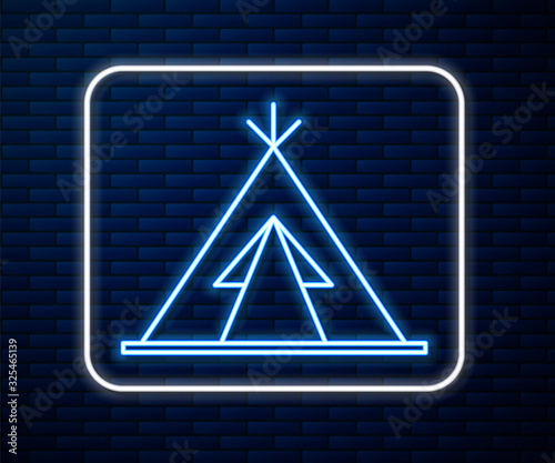 Glowing neon line Traditional indian teepee or wigwam icon isolated on brick wall background. Indian tent.  Vector Illustration