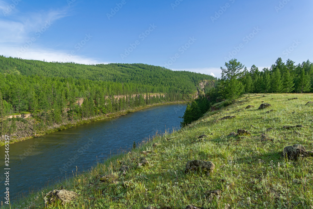 High steep rocky riverbank. Siberia.