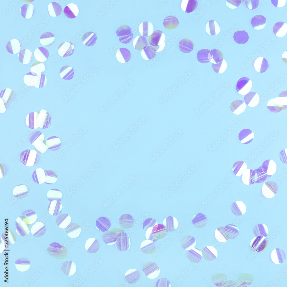 Pearl confetti on blue background. Flat lay, top view. Pearl confetti on blue background. Flat lay, top view.