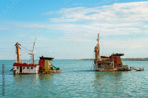 Panaroma view of Mersin and Shipwreck, Sunken ship near international sea port of Mersin. Turkey