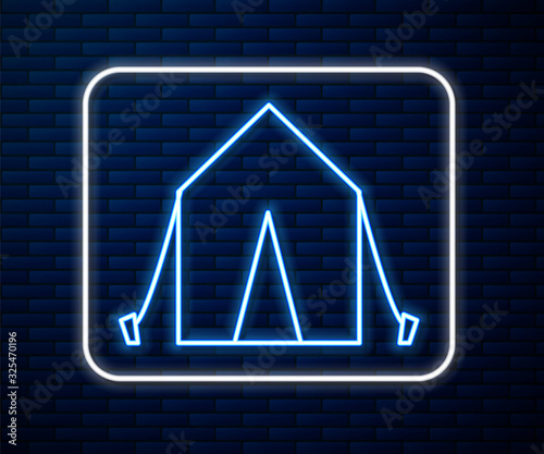 Glowing neon line Tourist tent icon isolated on brick wall background. Camping symbol.  Vector Illustration