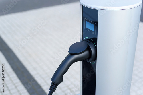 Charging station for electric cars engine. Eco friendly energy solution for future transport. Power supply for recharge vehicle.