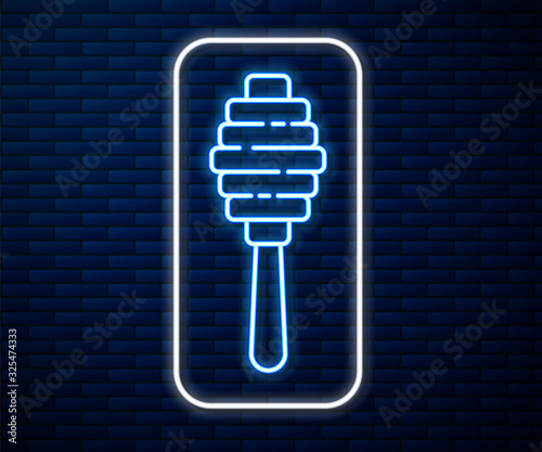 Glowing neon line Honey dipper stick icon isolated on brick wall background. Honey ladle. Vector Illustration