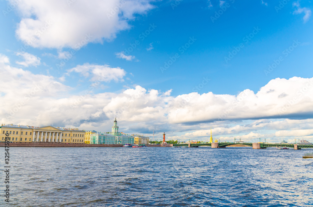 Cityscape of Saint Petersburg (Leningrad) city with Palace Bridge (bascule bridge) across Neva river, Kunstkamera building, Rostral Columns on Strelka Arrow of Vasilyevsky Island, Russia