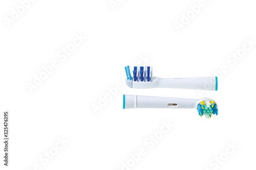 Two kinds of head for toothbrush Oral B close up view isolated. Health care concept. photo