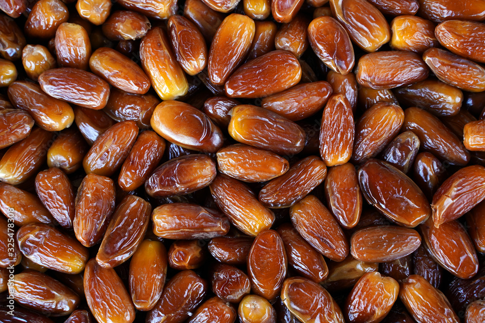 Dried honey dates from Tunisia. Background, food texture Dried honey dates from Tunisia. Background, food texture