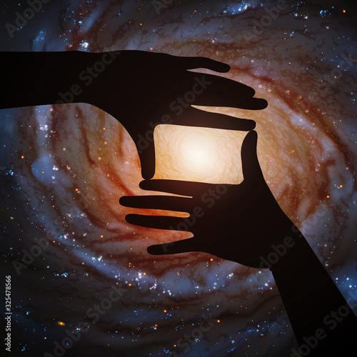 Spiral galaxy in framing hands of astronaut in space. Vector illustration with hand silhouette and astronomical object in cosmos. Dark starry background. Elements of this image furnished by NASA