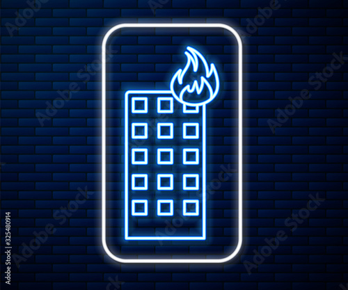 Glowing neon line Fire in burning building on city street icon isolated on brick wall background. Vector Illustration