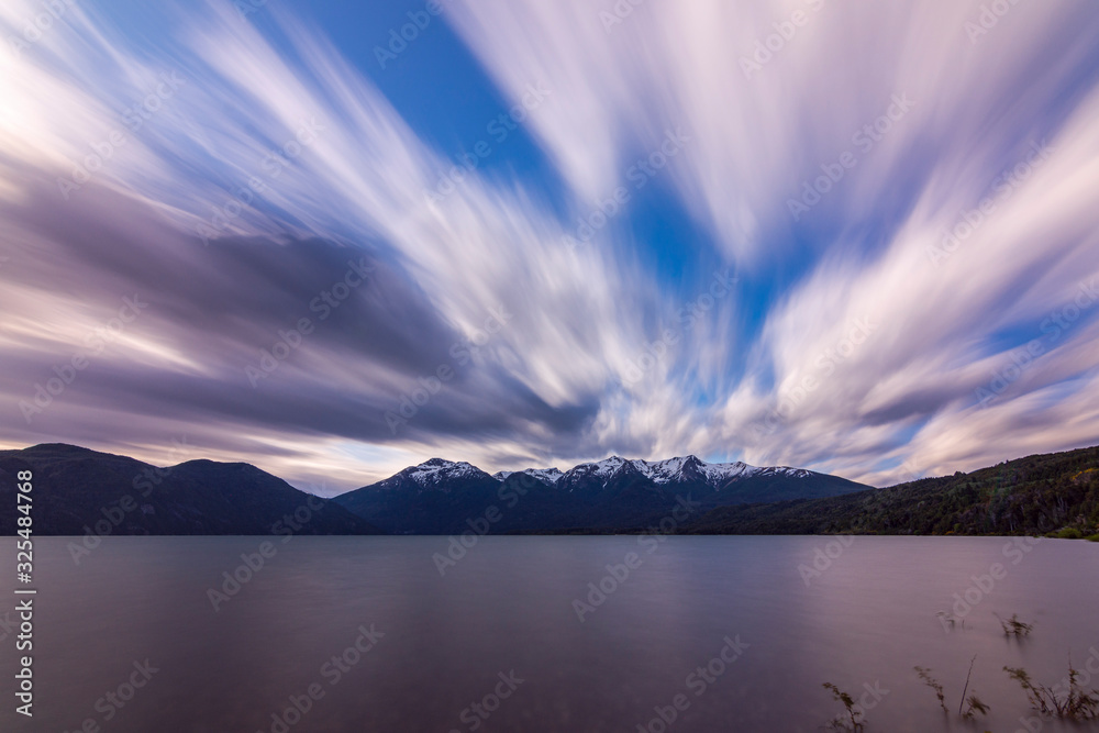 Long exposure shot during windy day in Futalaufquen lake against snow-capped Andes mountains, Los Alerces National Park, Patagonia, Argentina