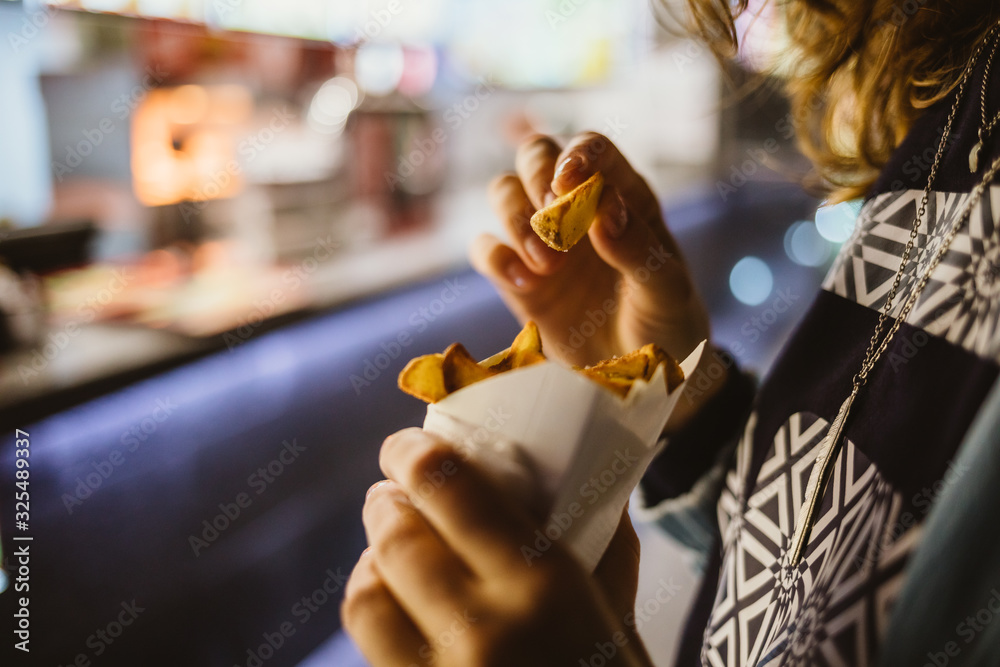 Close-up of young unrecognizable woman eating Close-up of young unrecognizable woman eating