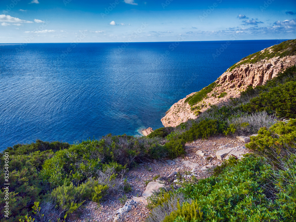 High angle view deep blue sea and lush Mediterranean vegetation in Sardegna a beautiful wilderness area over the sea