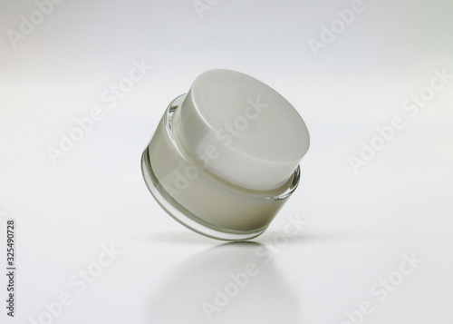 Glass jar of beauty cream with cap. blank packaging clear cosmetic cream pot isolated on white background with clipping path ready for cosmetic product design template.