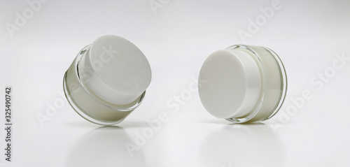 Glass jar of beauty cream with cap. blank packaging clear cosmetic cream pot isolated on white background with clipping path ready for cosmetic product design template. Set of cosmetic cream jars.