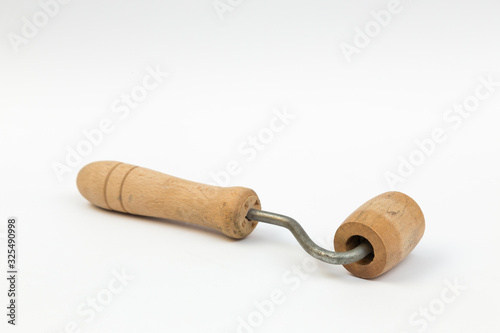 wooden roller on white background