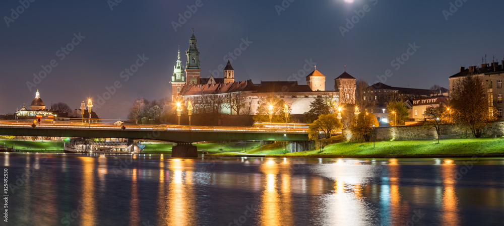 Krakow, Poland, Night panorama of Wawel Castle over Vistula river