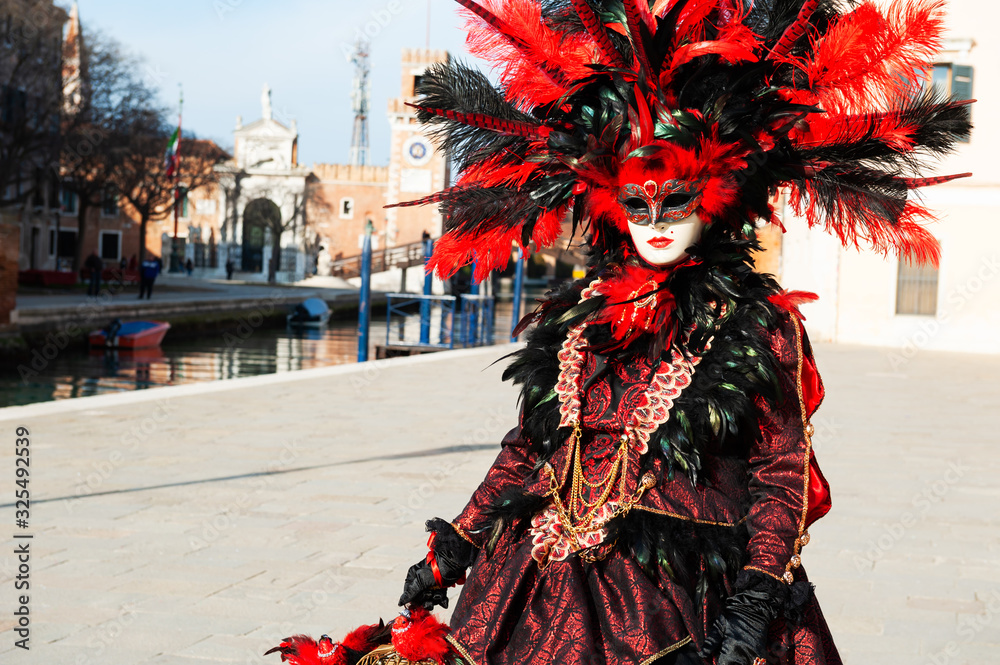 Beautiful colorful masks at traditional Venice Carnival in February 2020 in Venice, Italy
