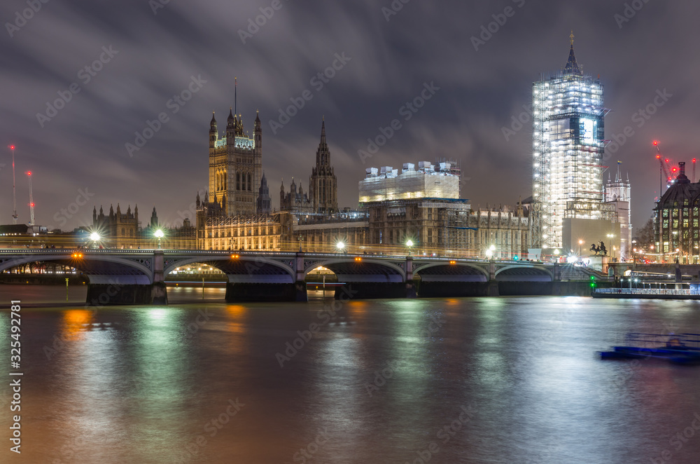 London in the night, Houses of Parliament over river Thames, Big Ben under renovation
