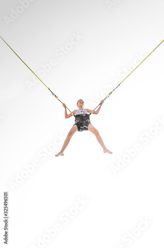 child jumping in the jumping attraction isolated