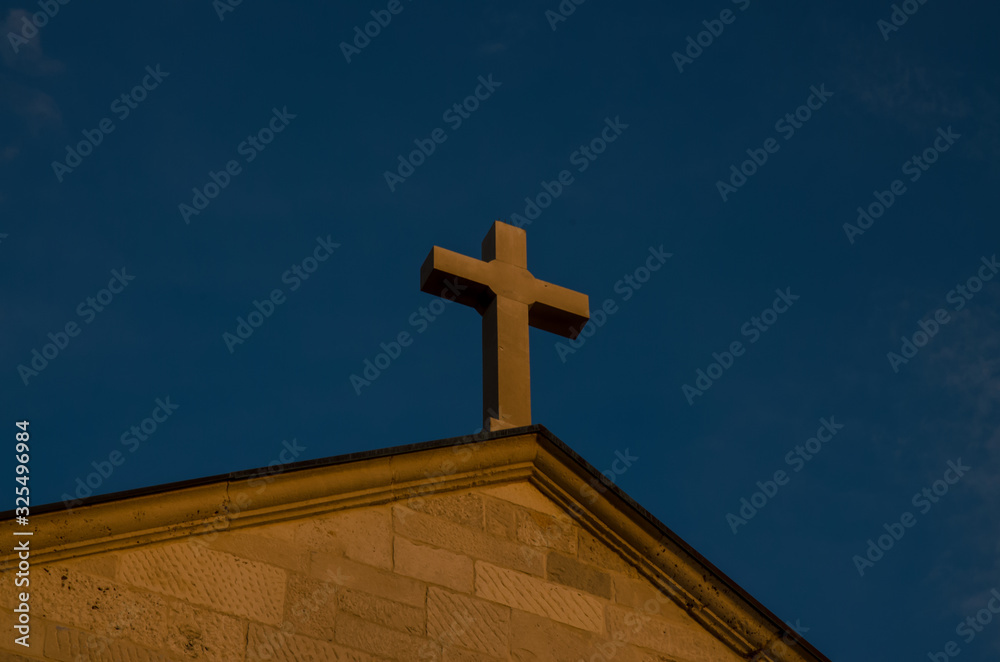 majestic christian cross at the sunset