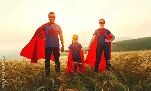concept of super family, family of superheroes at sunset .