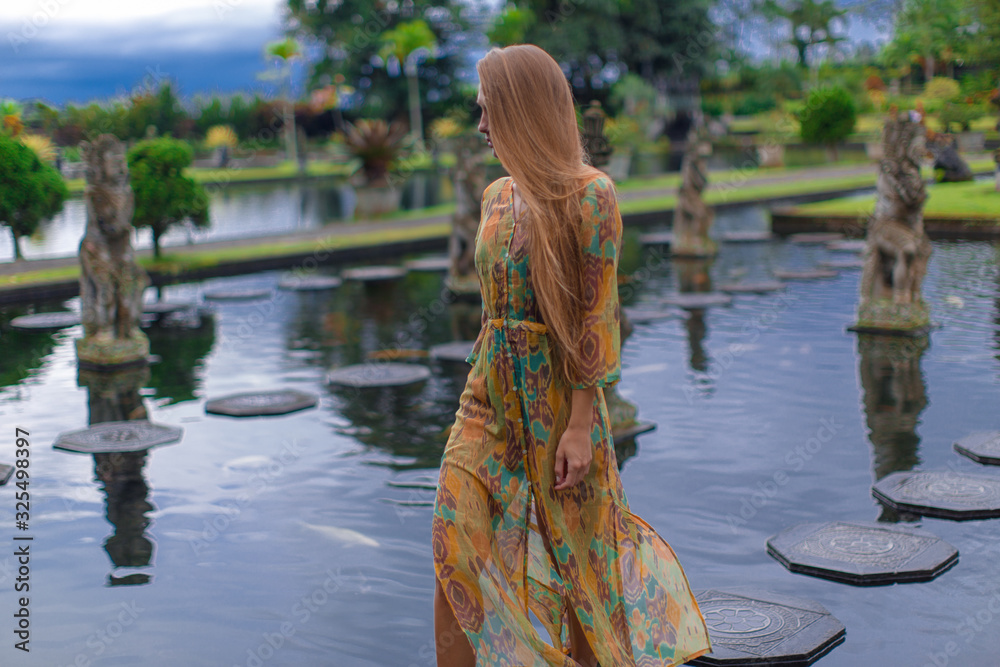 Beautiful girl in the water temple of Inlonesia. Bali. Beautiful girl in the water temple of Inlonesia. Bali.