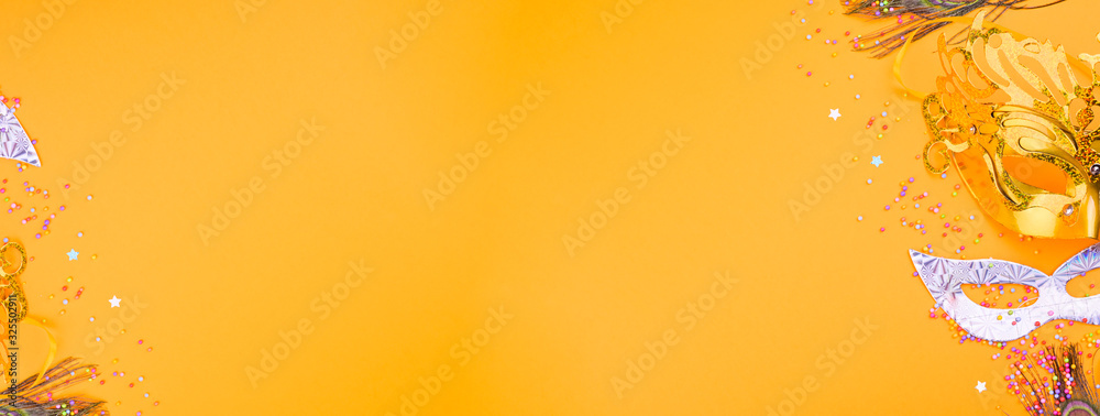 Carnival mask on a yellow background. Decor for a traditional Italian holiday. Copy space. Flat lay . Banner Carnival mask on a yellow background. Decor for a traditional Italian holiday. Copy space. Flat lay . Banner