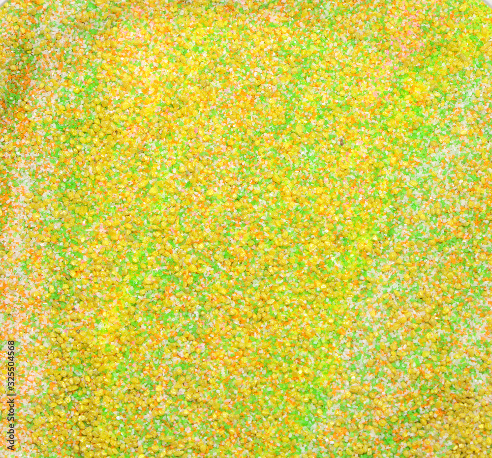 Yellow-green decorative sand textured background. Multi-colored small pebbles, photo background.