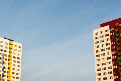 Two skyscrapers on the edge of the picture and in the middle a blue sky