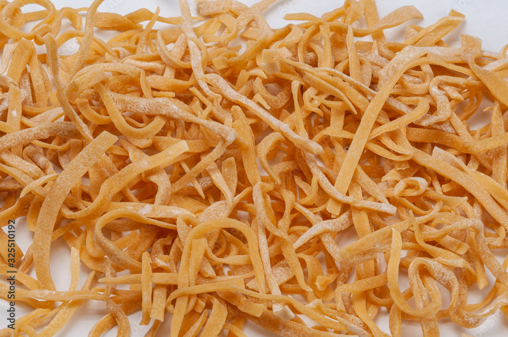 Homemade noodles on a white background. Homemade noodles on a white background.