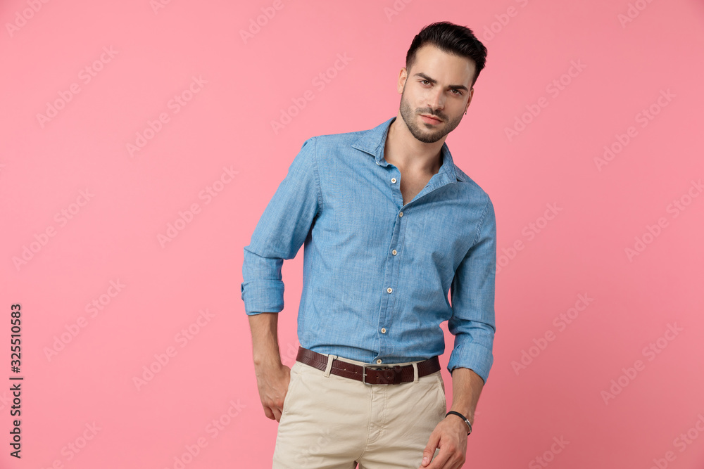Fototapeta premium young casual model holding hands in a fashion pose