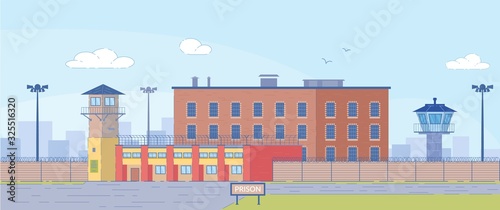 Prison Building Surrounded by High Fence Exterior.