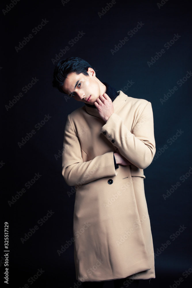handsome asian fashion looking man posing in studio on black background, lifestyle modern people concept handsome asian fashion looking man posing in studio on black background, lifestyle modern people concept