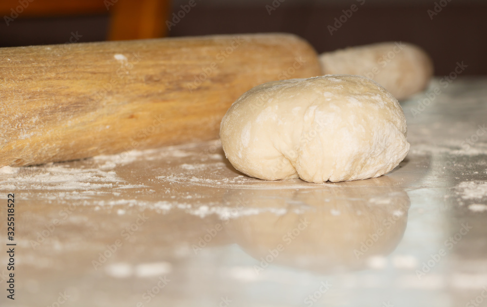 Dough cooked manually, in the process of cooking pies Dough cooked manually, in the process of cooking pies